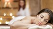 Medical Wellness Hotels in Südtirol Frau entspannt bei Massage in einem ruhig beleuchteten Spa-Raum